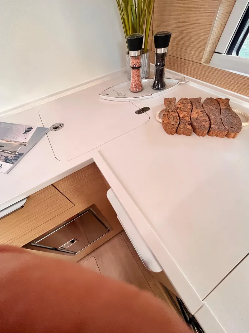 Slide: The Image of Modern kitchen interior of 2025 Hanse 460 yacht with sliced bread and condiments. - 29