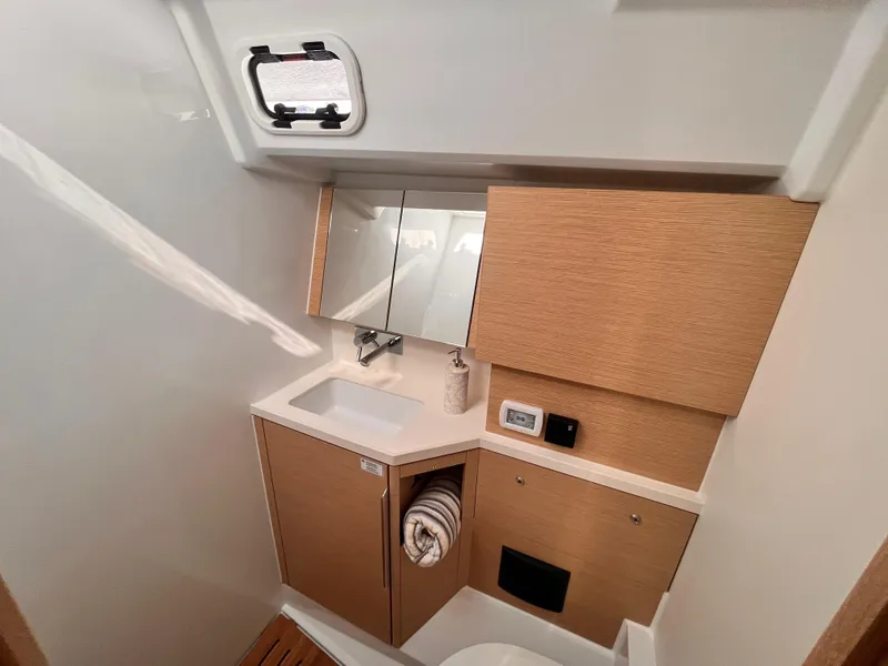 Slide: The Image of Modern bathroom interior of 2025 Hanse 460 yacht with wood accents and compact design. - 31