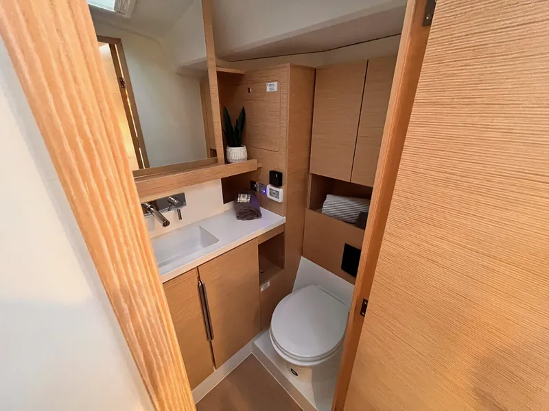 Slide: The Image of Modern bathroom in 2025 Hanse 460 yacht with wooden cabinetry and sleek fixtures. - 35
