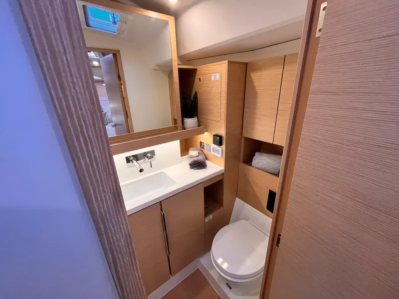 Slide: The Image of Modern bathroom in 2025 Hanse 460 yacht with sleek wood cabinetry and compact design. - 36