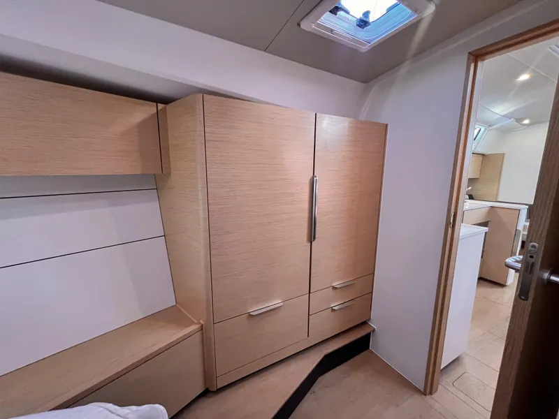 Slide: The Image of Modern interior of 2025 Hanse 460 yacht with wooden cabinetry and sleek design. - 40