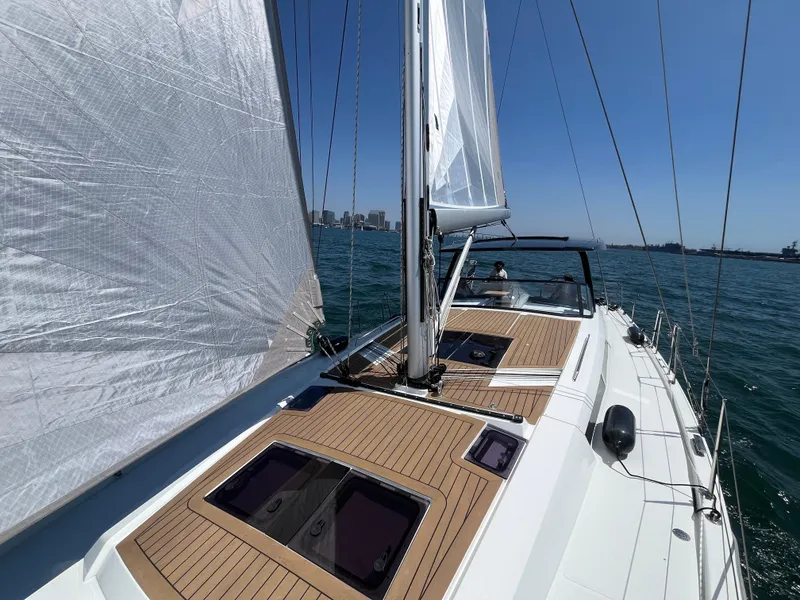 Slide: The Image of Sailing on a 2025 Hanse 460 yacht with open sails on a sunny day. - 43