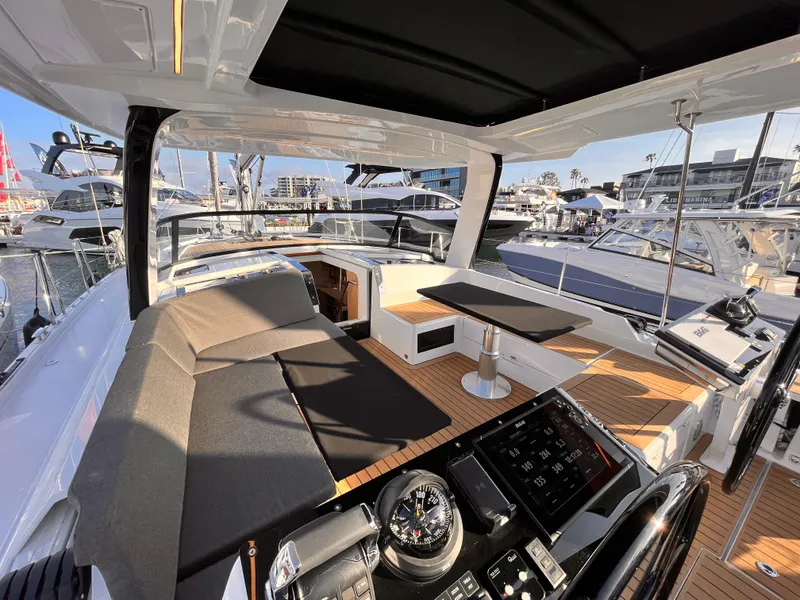 Slide: The Image of Luxurious 2025 Hanse 460 yacht interior with modern seating and navigation equipment. - 5