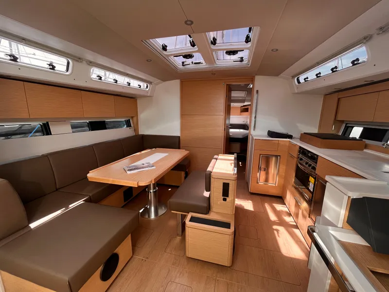 Slide: The Image of Modern interior of 2025 Hanse 460 yacht with sleek design and ample natural light. - 8