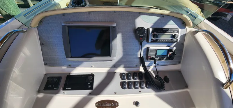 Slide: The Image of 2013 Chris-Craft Catalina 29 Sun Tender dashboard with navigation and control systems. - 11
