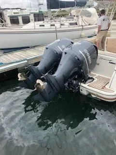 Slide: The Image of 2013 Chris-Craft Catalina 29 Sun Tender with dual outboard engines docked at marina. - 16