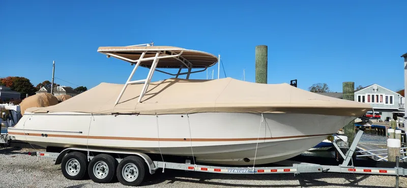 Slide: The Image of 2013 Chris-Craft Catalina 29 Sun Tender on trailer, covered, outdoors. - 18