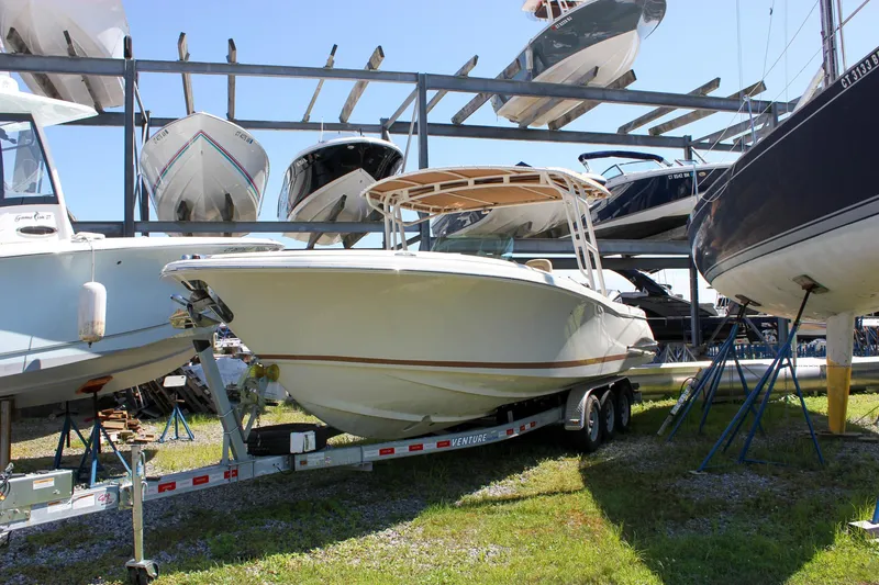 Slide: The Image of 2013 Chris-Craft Catalina 29 Sun Tender on trailer in boat storage facility. - 19