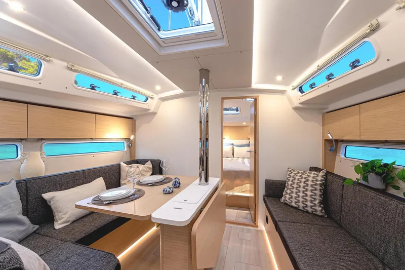 Slide: The Image of Interior of 2025 Hanse 360 #41 yacht, featuring modern seating and dining area. - 33