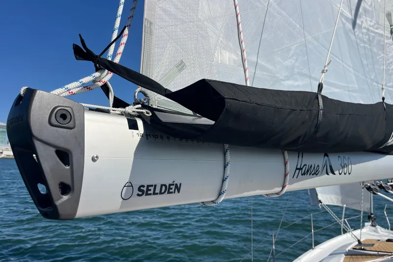 Slide: The Image of Sailboat boom of 2026 Hanse 360 with Selden branding on a sunny day. - 40
