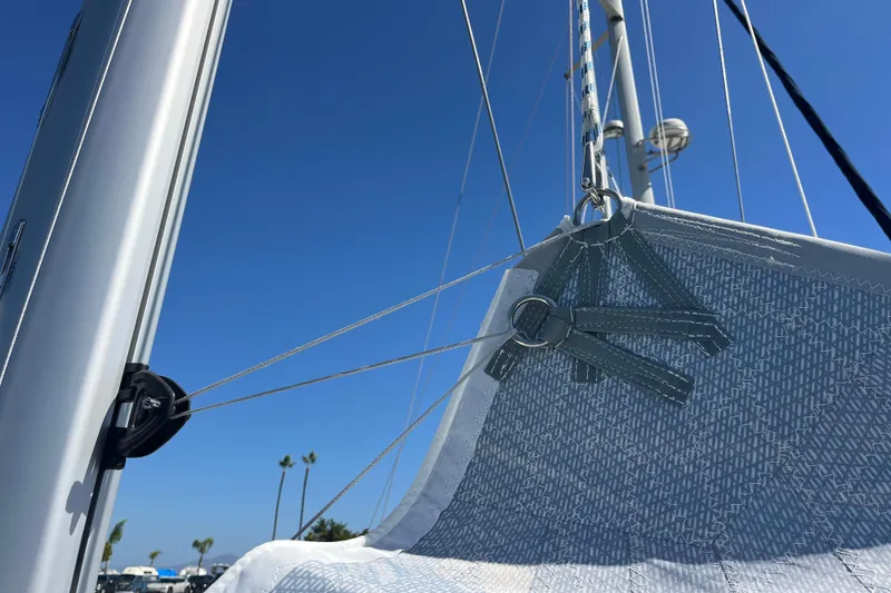 Slide: The Image of Close-up of Hanse 360 sailboat rigging against clear blue sky, 2026 model. - 42