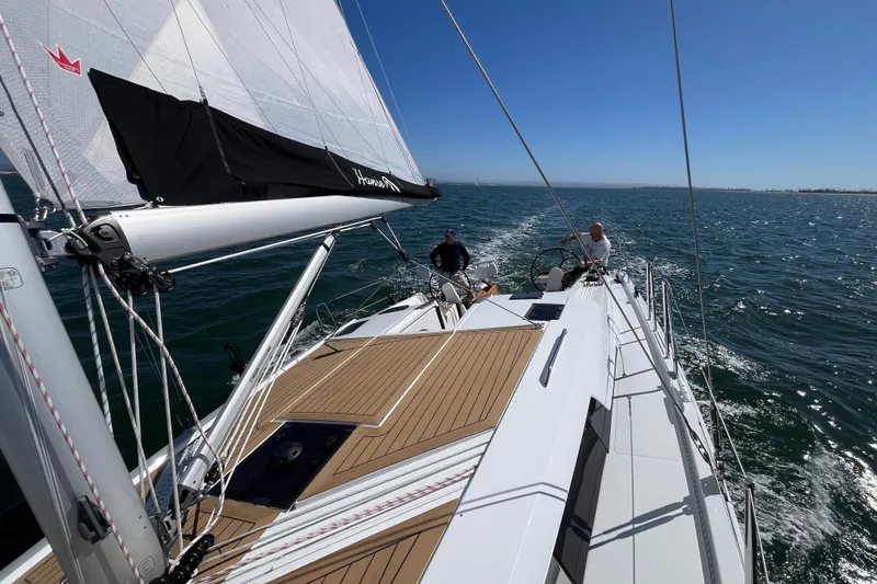 Slide: The Image of 2026 Hanse 360 sailboat navigating open waters under clear blue skies. - 44