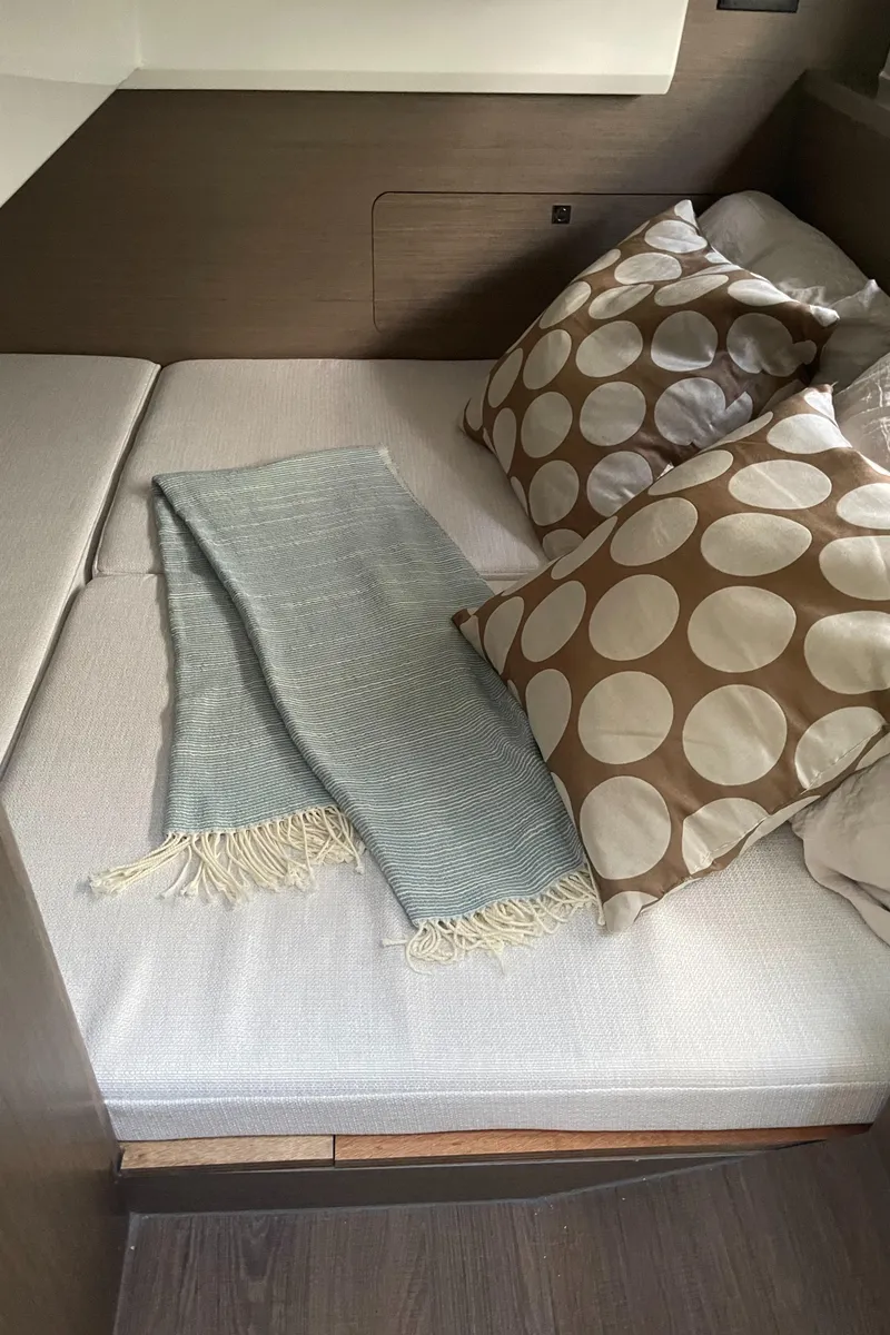 Slide: The Image of Cozy cabin interior of 2025 Jeanneau NC 895 Series 2 with stylish bedding. - 13