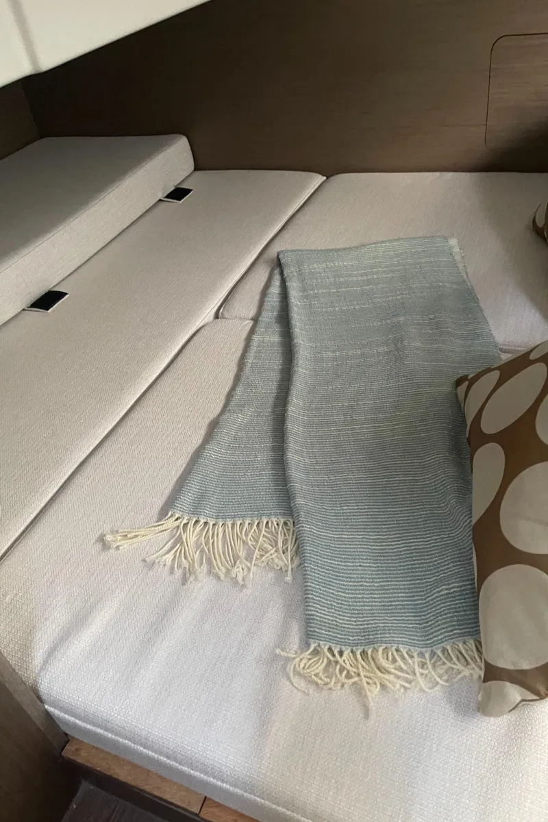 Slide: The Image of Interior cabin of 2025 Jeanneau NC 895 Series 2 with cozy bedding. - 15