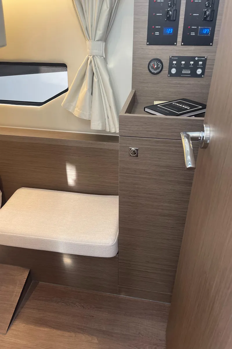 Slide: The Image of Interior of 2025 Jeanneau NC 895 Series 2 boat with seating and control panel. - 19