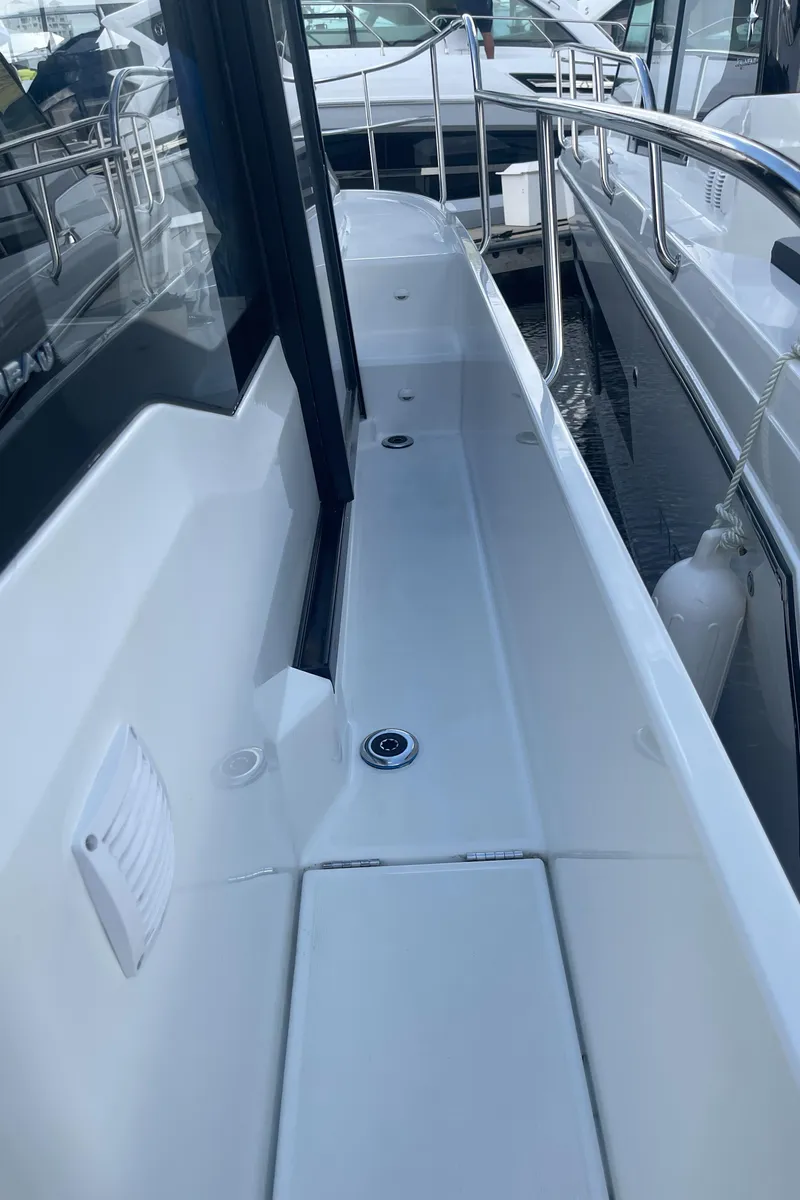 Slide: The Image of 2025 Jeanneau NC 895 Series 2 boat deck with sleek design and modern features. - 8