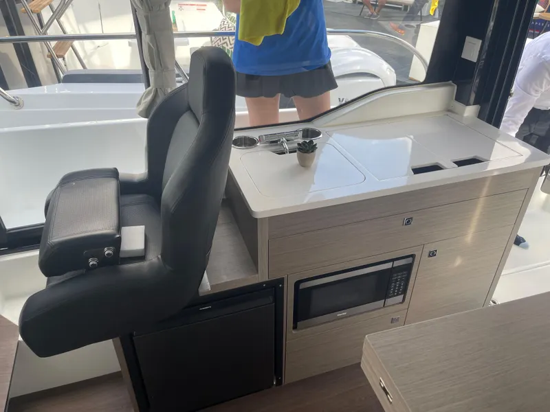 The Image of 2026 Jeanneau NC 895 Series 2 boat displayed outdoors on a sunny day. - 1