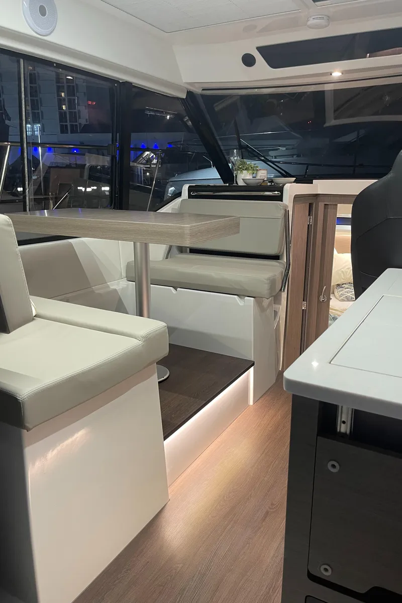 Slide: The Image of Interior cabin of 2026 Jeanneau NC 895 Series 2 boat, featuring modern wood paneling. - 22