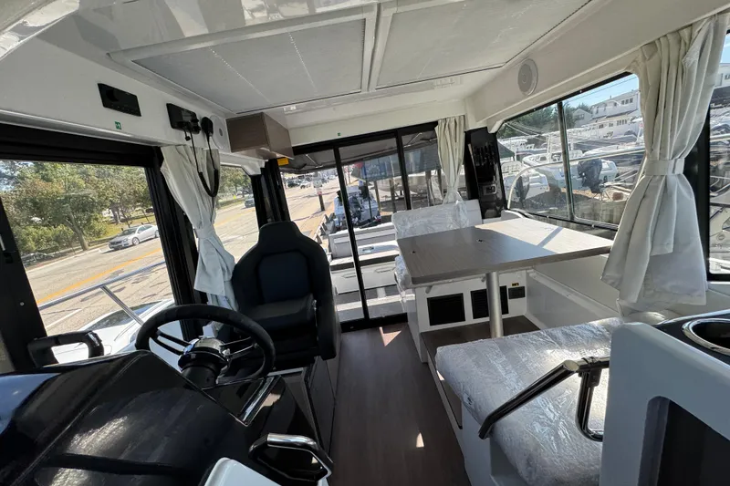 Slide: The Image of Interior of 2026 Jeanneau NC 895 Series 2 boat, featuring modern helm and seating area. - 32