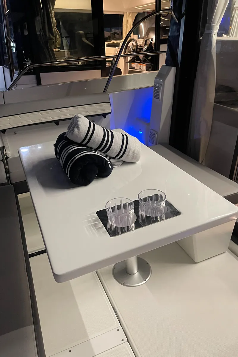 Slide: The Image of Interior of 2026 Jeanneau NC 895 Series 2 boat with kitchen and seating area. - 6