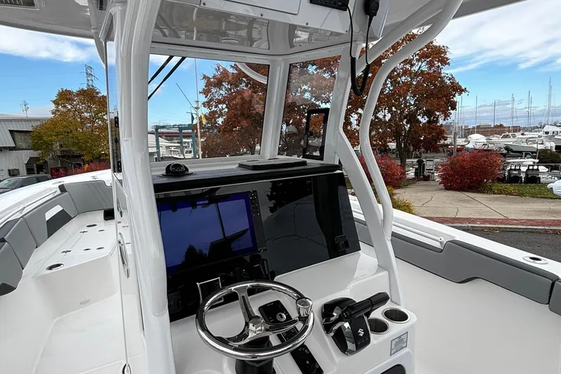 Slide: The Image of 2025 Sea Pro 292 DLX boat interior with modern helm and navigation system. - 10