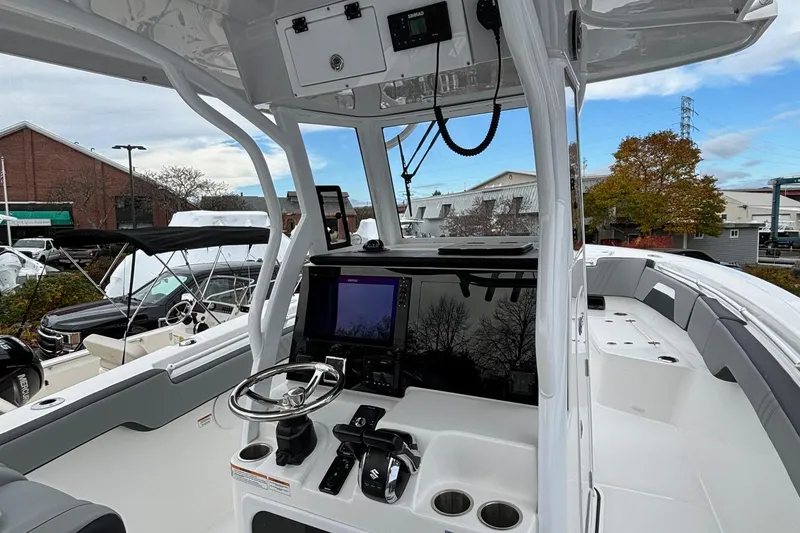 Slide: The Image of 2025 Sea Pro 292 DLX boat interior with modern helm and navigation equipment. - 11