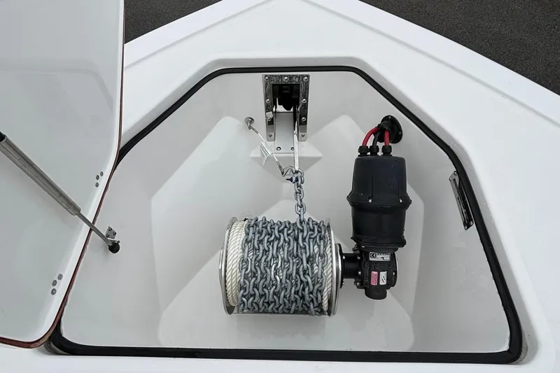 Slide: The Image of Anchor storage compartment on 2025 Sea Pro 292 DLX boat with chain and winch. - 19