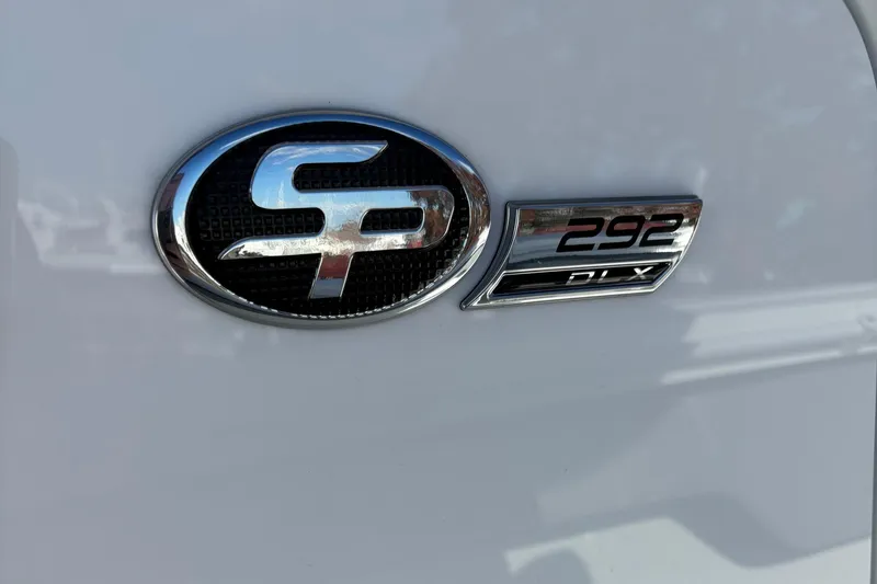 Slide: The Image of 2025 Sea Pro 292 DLX logo on white surface. - 22