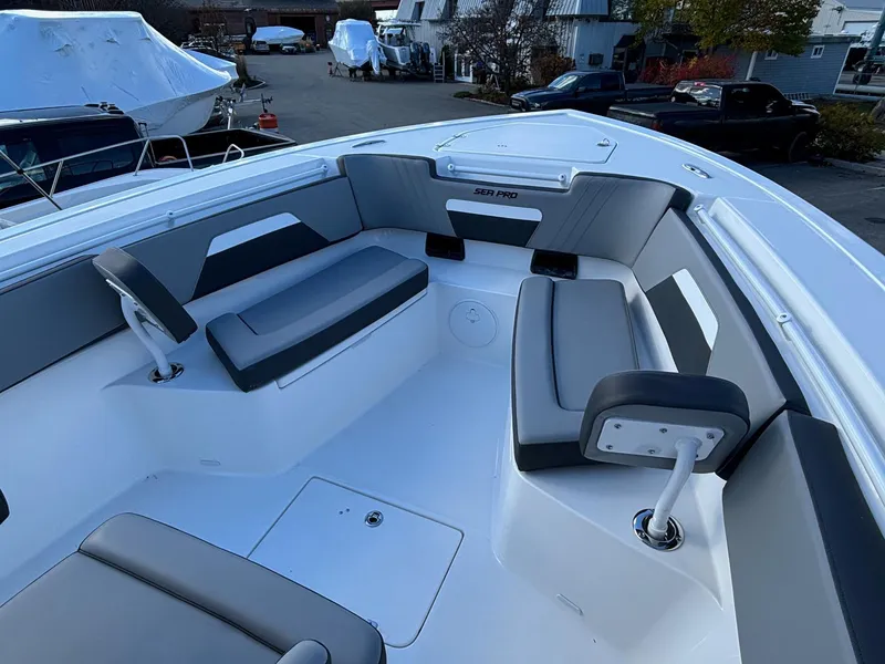 Slide: The Image of 2025 Sea Pro 292 DLX boat interior with sleek seating and modern design. - 3