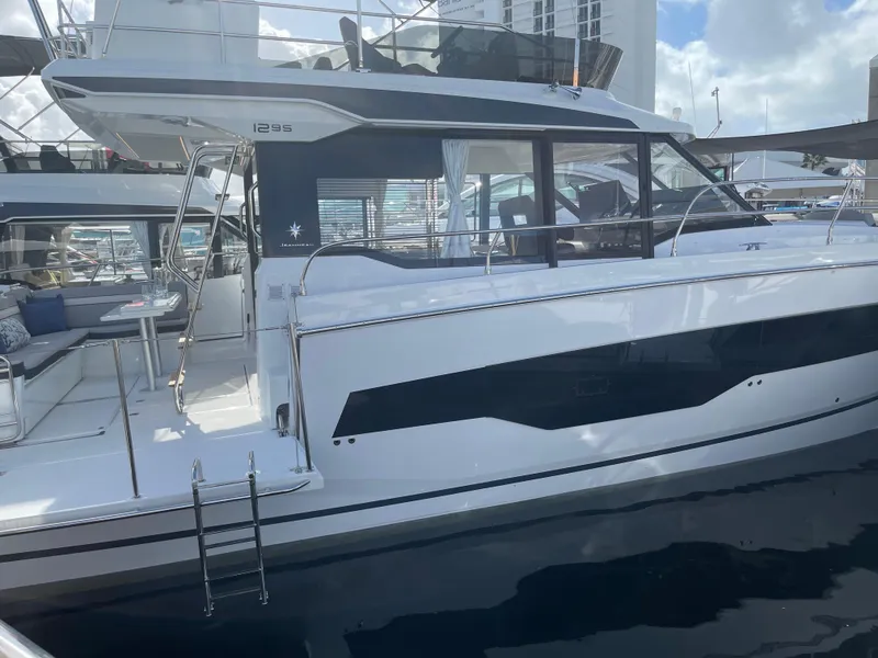 The Image of 2025 Jeanneau NC 1295 Coupe yacht docked, showcasing sleek design and modern features. - 1