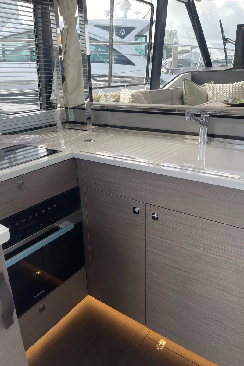 Slide: The Image of Modern kitchen interior of 2025 Jeanneau NC 1295 Coupe yacht. - 5