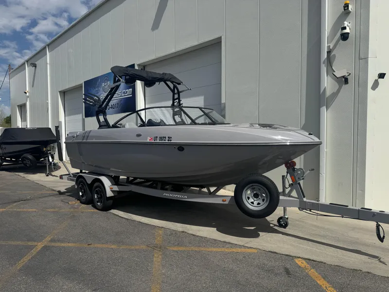 Slide: The Image of 2021 Moomba Craz boat on trailer outside a building, ready for transport. - 1