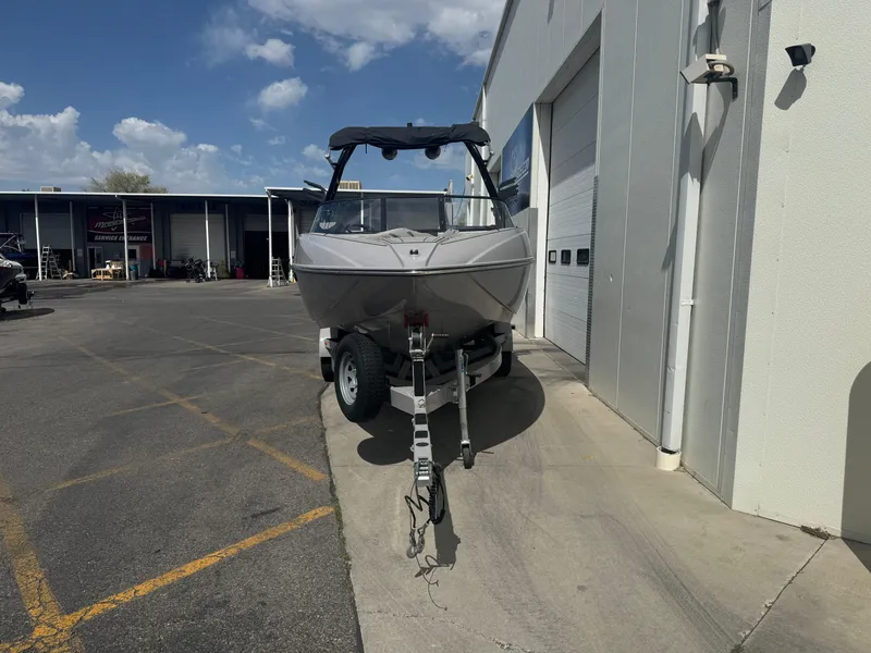 Slide: The Image of 2021 Moomba Craz boat on trailer outside a storage facility. - 2