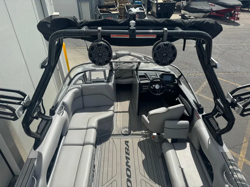 Slide: The Image of 2021 Moomba Craz boat interior with spacious seating and modern dashboard. - 6