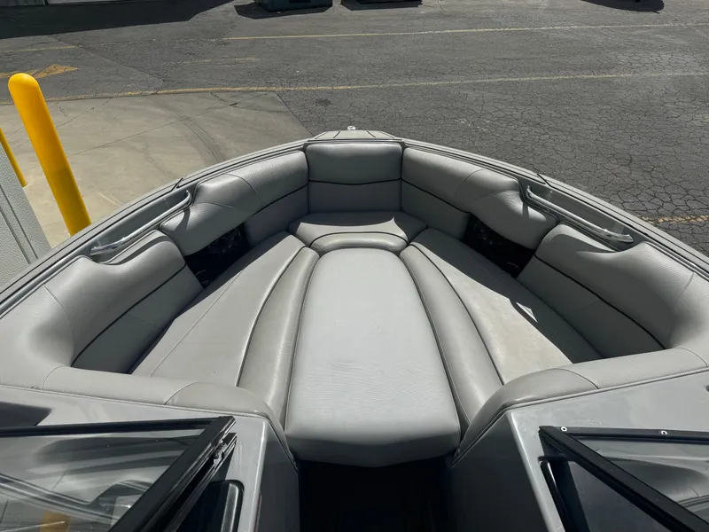 Slide: The Image of 2021 Moomba Craz boat interior with gray seating and open bow design. - 9