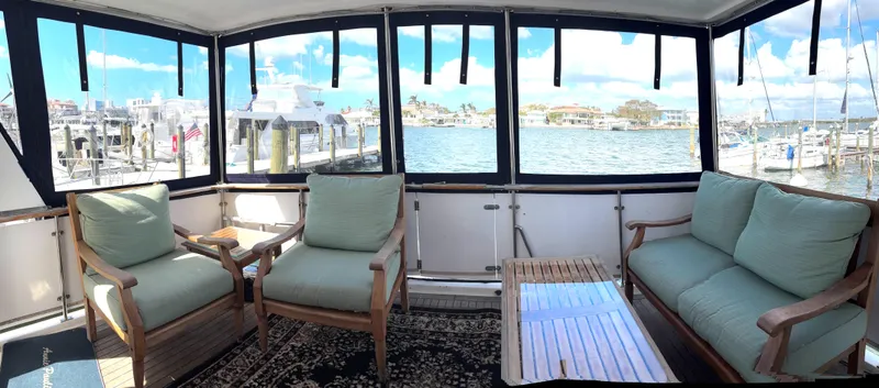 Slide: The Image of Interior of 1988 Marine Trader Tradewinds 43 Motor Yacht with seating and waterfront view. - 10