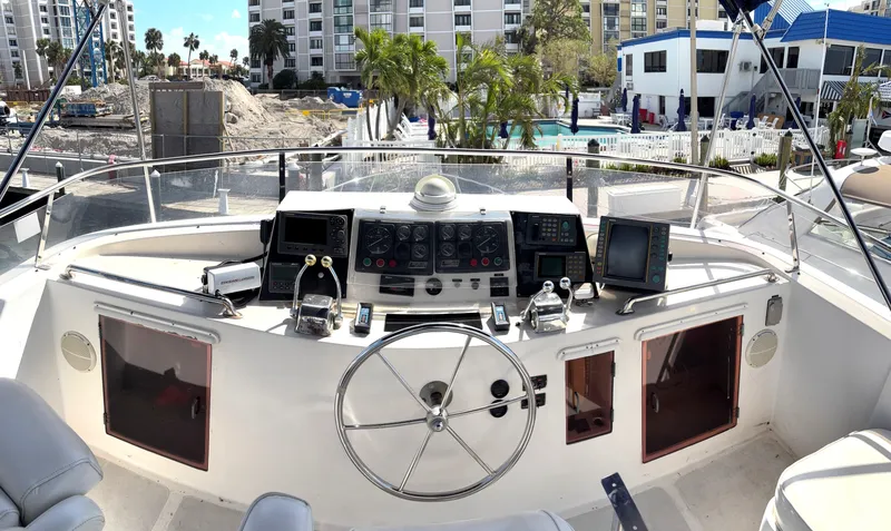 Slide: The Image of 1988 Marine Trader Tradewinds 43 Motor Yacht helm with navigation instruments and steering wheel. - 15