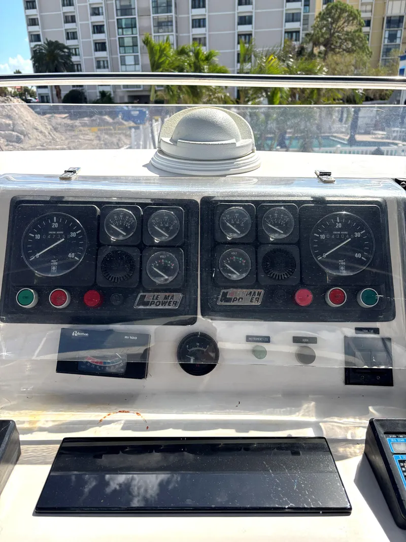 Slide: The Image of Control panel of 1988 Marine Trader Tradewinds 43 Motor Yacht with gauges and compass. - 19