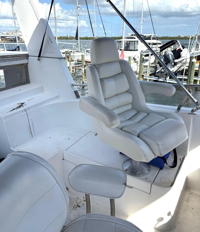 Slide: The Image of Captain's chair on 1988 Marine Trader Tradewinds 43 Motor Yacht, docked at marina. - 22