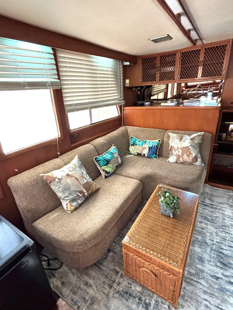 Slide: The Image of Cozy interior of 1988 Marine Trader Tradewinds 43 Motor Yacht with plush seating and decorative pillows. - 28