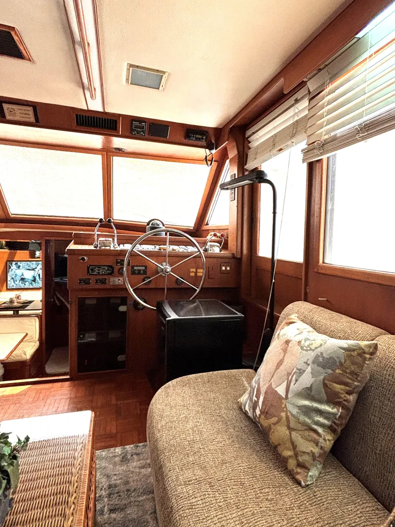 Slide: The Image of Interior of 1988 Marine Trader Tradewinds 43 Motor Yacht with helm and seating area. - 34