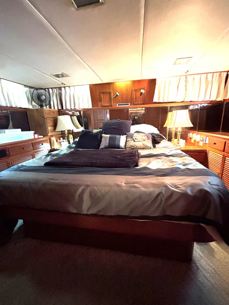 Slide: The Image of Luxurious bedroom interior of 1988 Marine Trader Tradewinds 43 Motor Yacht. - 48
