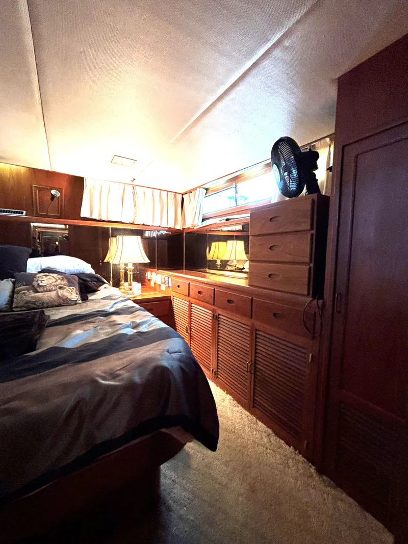 Slide: The Image of Cozy bedroom interior of 1988 Marine Trader Tradewinds 43 Motor Yacht. - 49