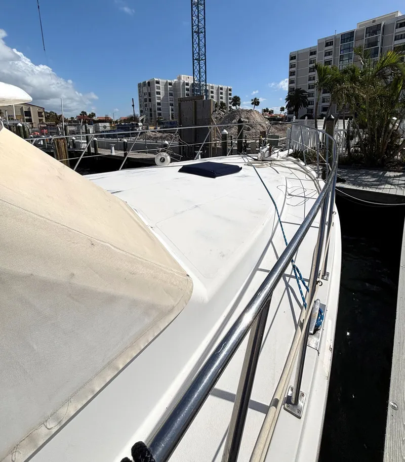 Slide: The Image of 1988 Marine Trader Tradewinds 43 Motor Yacht docked in a marina, sunny day. - 7
