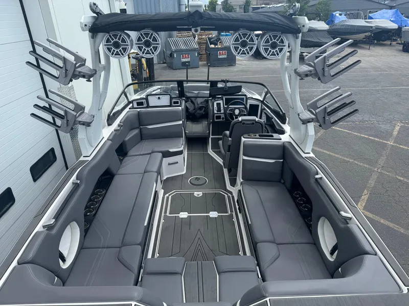 Slide: The Image of 2023 Supra SE 550 boat interior with spacious seating and advanced audio system. - 7