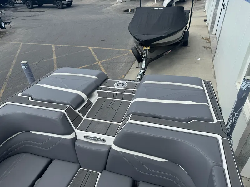 Slide: The Image of 2023 Supra SE 550 boat with sleek gray seating and modern design. - 8