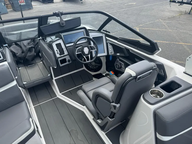 Slide: The Image of 2023 Supra SE 550 boat interior with modern dashboard and steering wheel. - 9