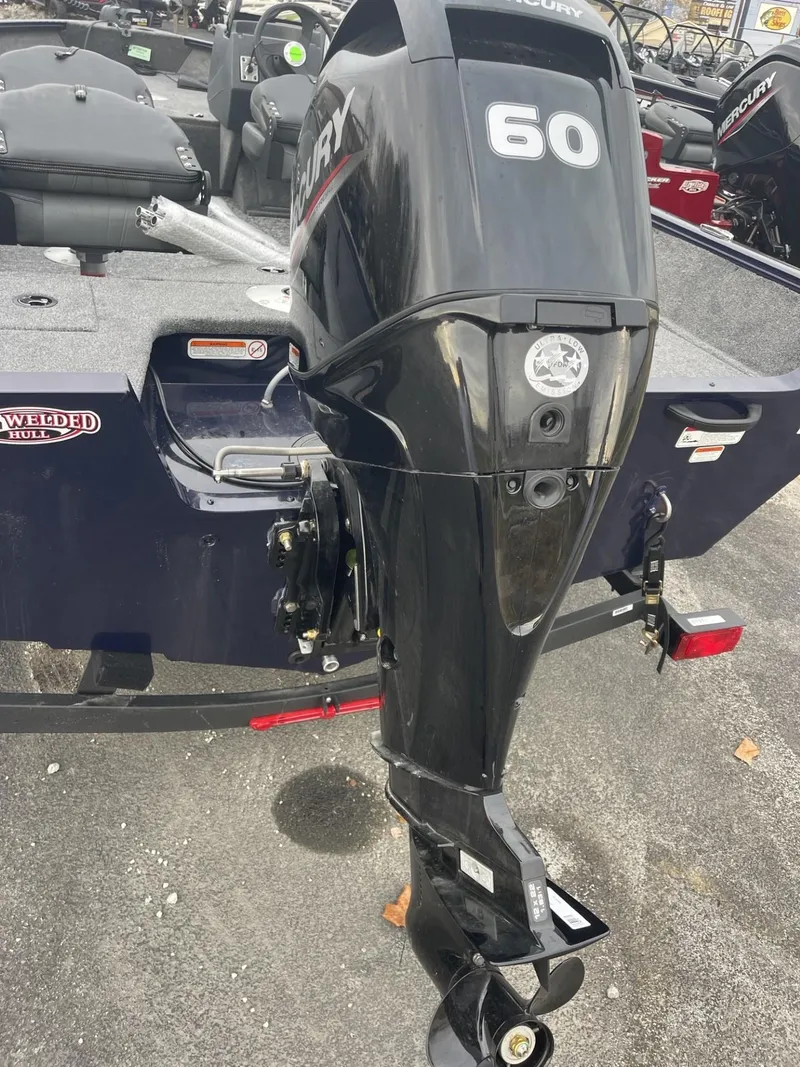 Slide: The Image of 2025 Tracker Pro Guide V-16 SC boat with Mercury 60 outboard motor. - 3