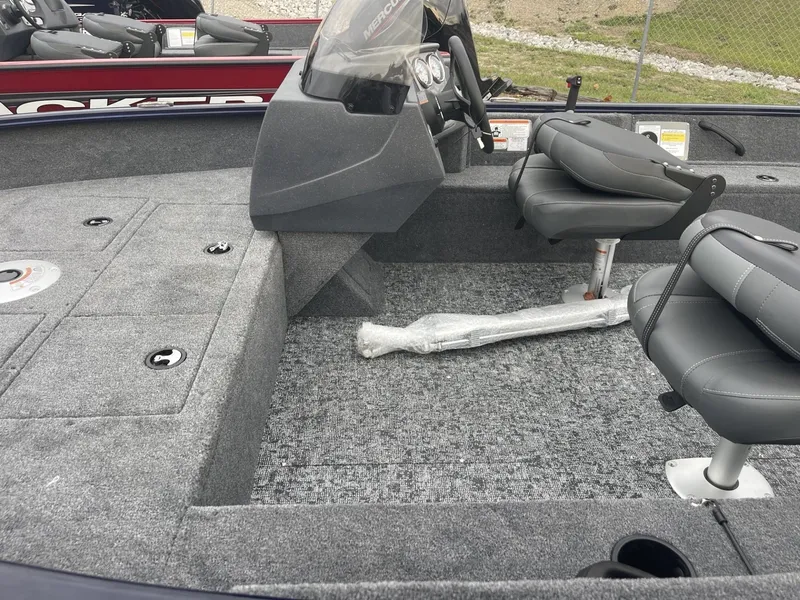 Slide: The Image of 2025 Tracker Pro Guide V-16 SC boat interior with seating and steering console. - 6