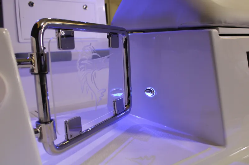 Slide: The Image of 2025 Marlago 37 SS boat interior with illuminated blue lighting and sleek design. - 8